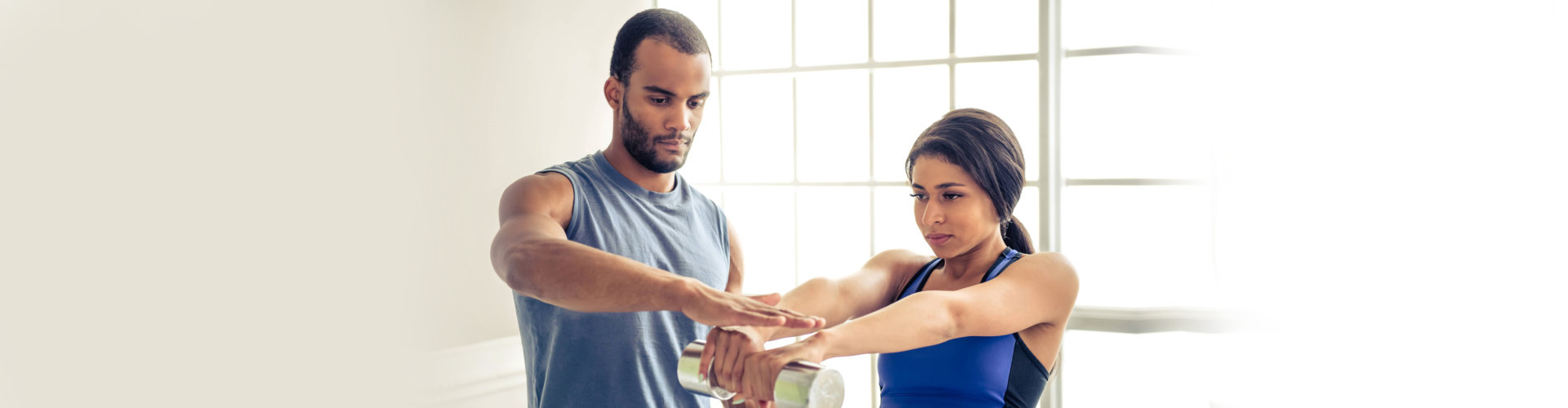 woman and her personal trainer